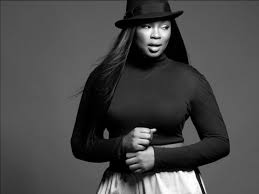 Black and white portrait of Liris Crosse in a hat